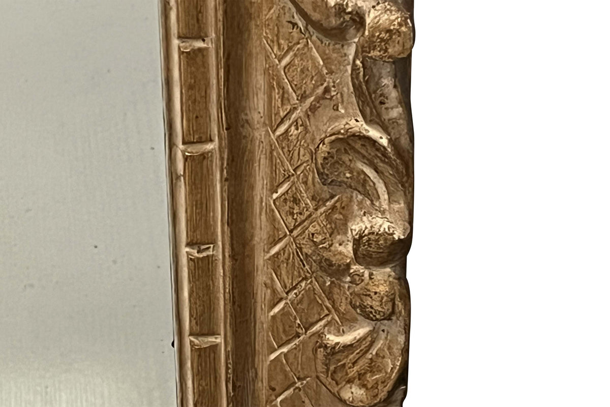 Early 20th Century French carved giltwood wall mirror of rectangular form.