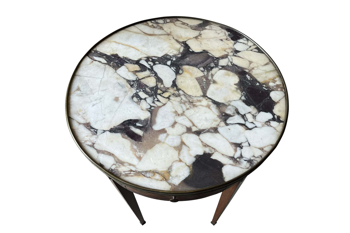 A finely proportioned early 20th Century French Louis XVI Revival bouillotte gueridon table.