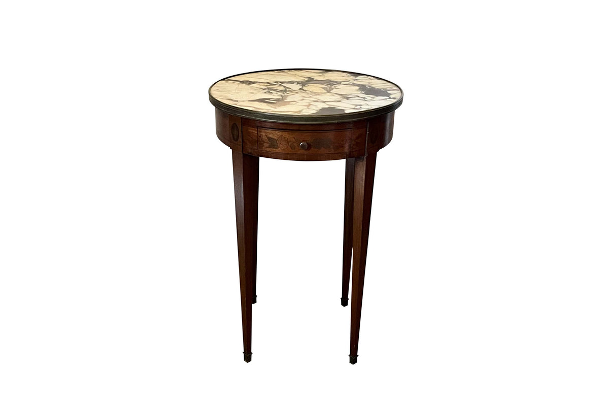A finely proportioned early 20th Century French Louis XVI Revival bouillotte gueridon table.