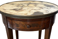 A finely proportioned early 20th Century French Louis XVI Revival bouillotte gueridon table.