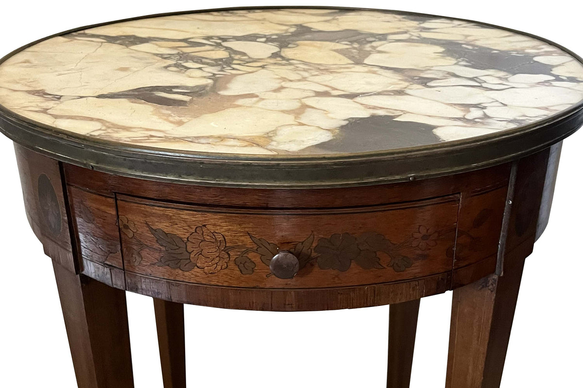 A finely proportioned early 20th Century French Louis XVI Revival bouillotte gueridon table.