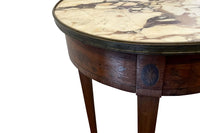 A finely proportioned early 20th Century French Louis XVI Revival bouillotte gueridon table.