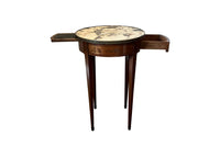 A finely proportioned early 20th Century French Louis XVI Revival bouillotte gueridon table.