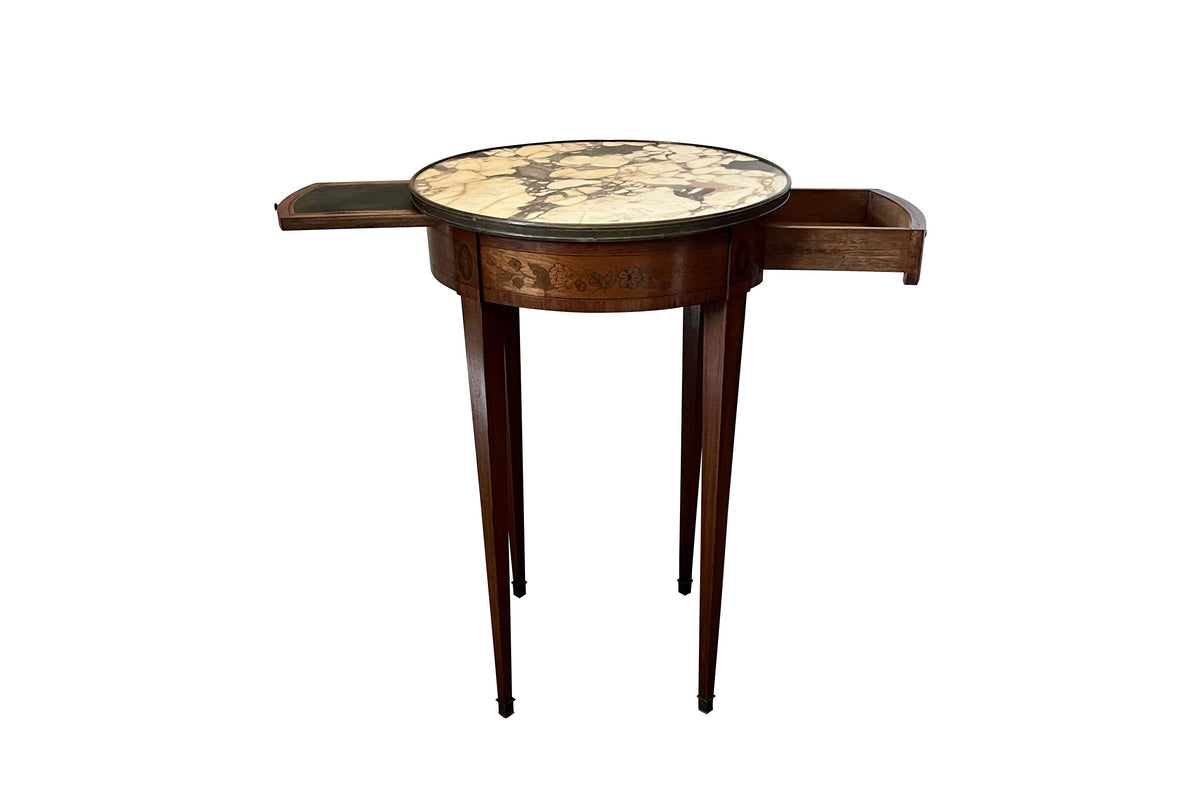 A finely proportioned early 20th Century French Louis XVI Revival bouillotte gueridon table.