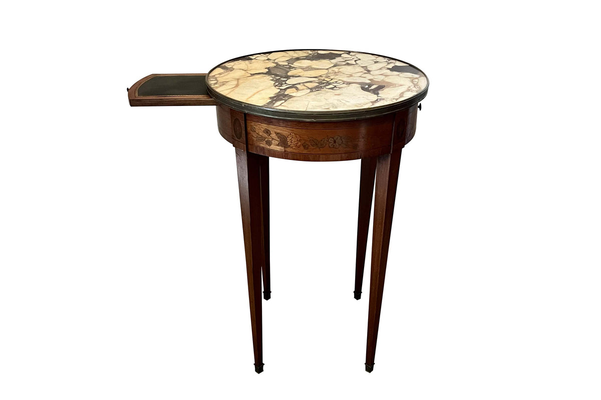 A finely proportioned early 20th Century French Louis XVI Revival bouillotte gueridon table.