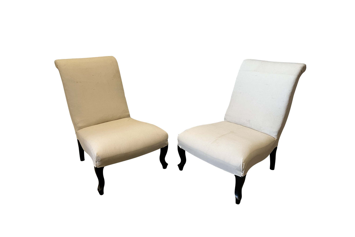 Pair of 19th Century French Napoleon III slipper chairs with scroll backs. 