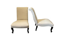 Pair of 19th Century French Napoleon III slipper chairs with scroll backs. 