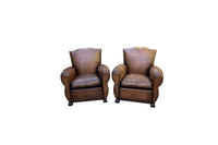 Pair of French Art Deco Moustache-Back Leather Club Chairs