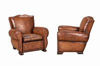 PAIR OF FRENCH ART DECO MOUSTACHE-BACK LEATHER CLUB CHAIRS