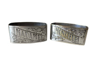 A charming pair of early 20th Century French silver-plated napkin rings engraved Madame and Monsieur. 
