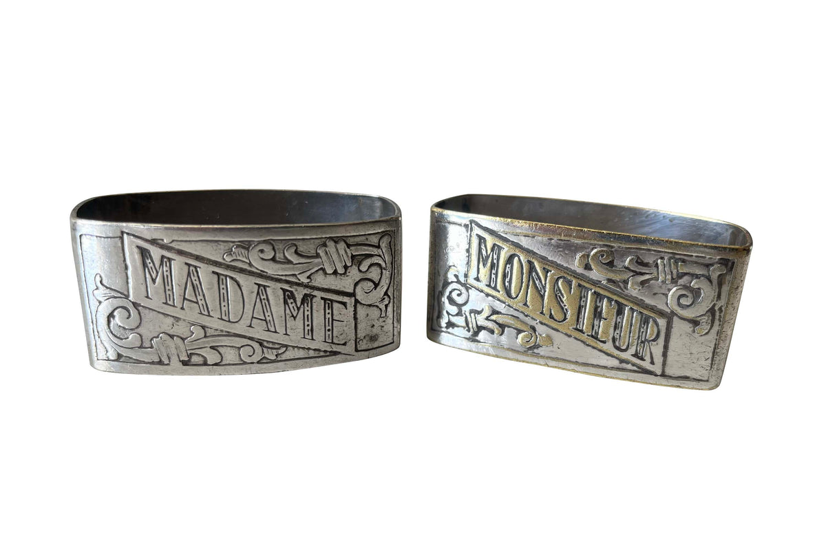 A charming pair of early 20th Century French silver-plated napkin rings engraved Madame and Monsieur. 