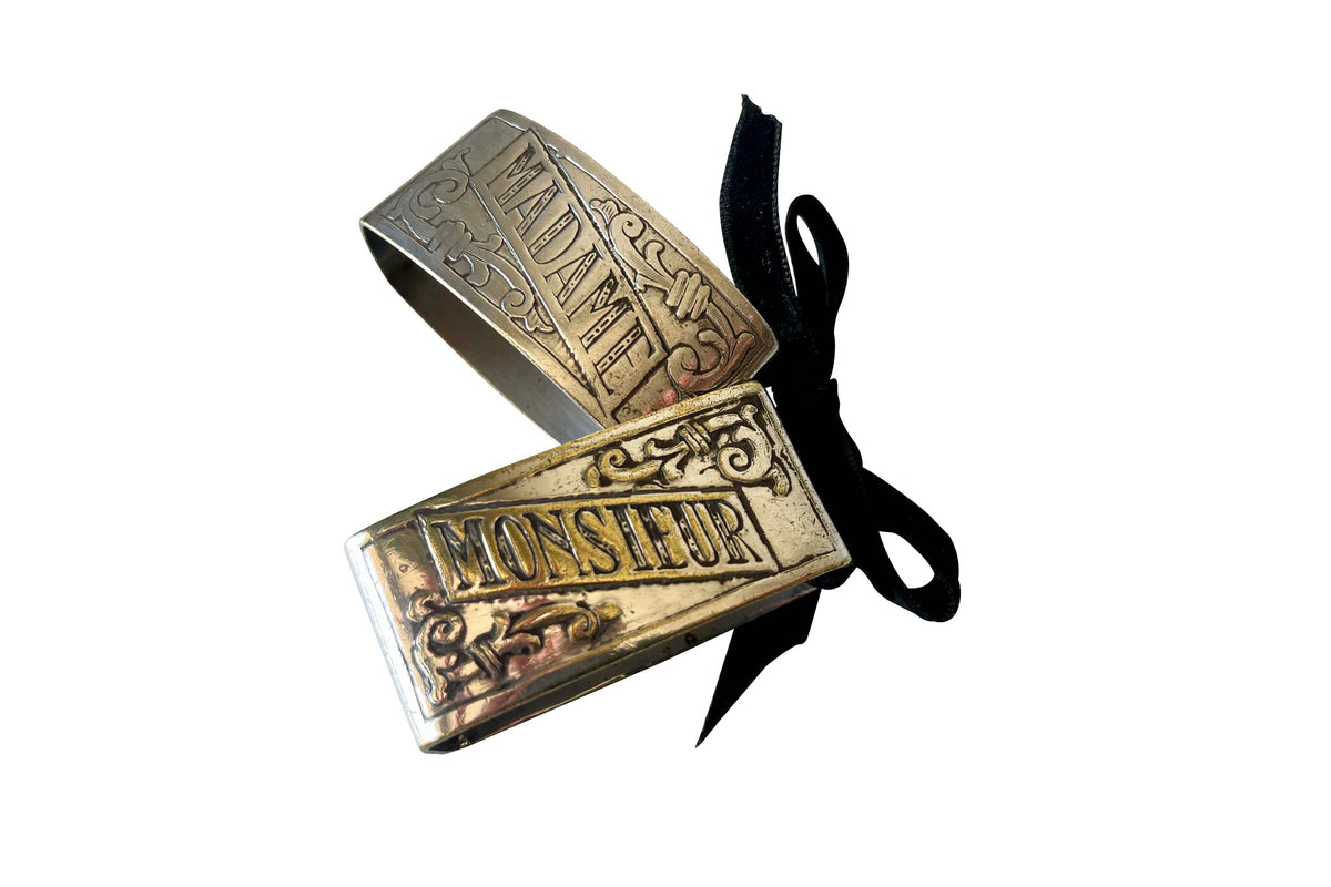 A charming pair of early 20th Century French silver-plated napkin rings engraved Madame and Monsieur. 