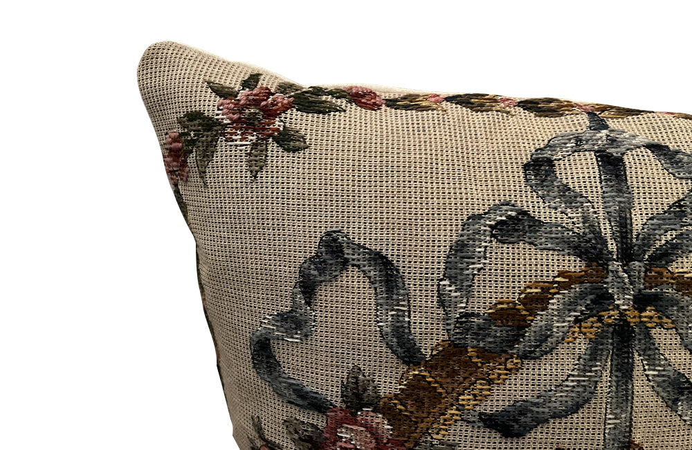 Antique cushion needlepoint tapestry 20th Century French Neo-Classical Revival featuring a classic floral basket motif with ribbon detailing. French Antiques