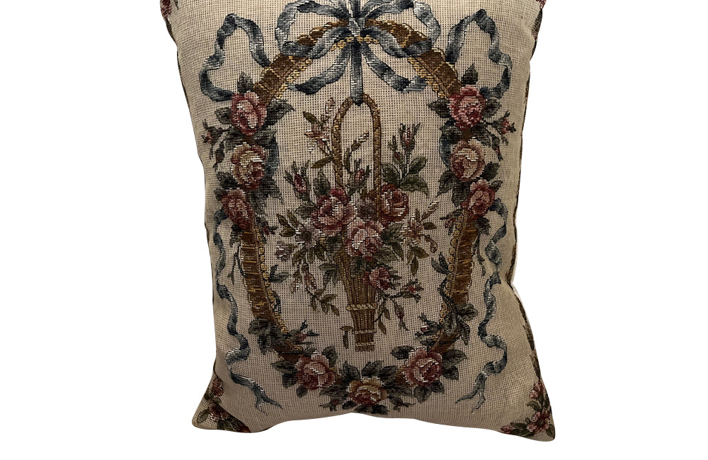 Antique cushion needlepoint tapestry 20th Century French Neo-Classical Revival featuring a classic floral basket motif with ribbon detailing. French Antiques