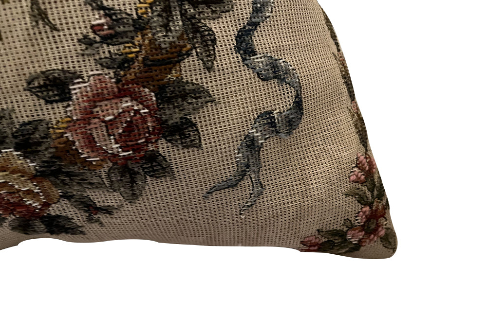 Antique cushion needlepoint tapestry 20th Century French Neo-Classical Revival featuring a classic floral basket motif with ribbon detailing. French Antiques
