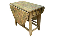 Antique table, painted, drop-leaf, Italian. hand-painted top decorated in scrolling foliate and floral motifs in warm ochre, green, lavender and terracotta tones.