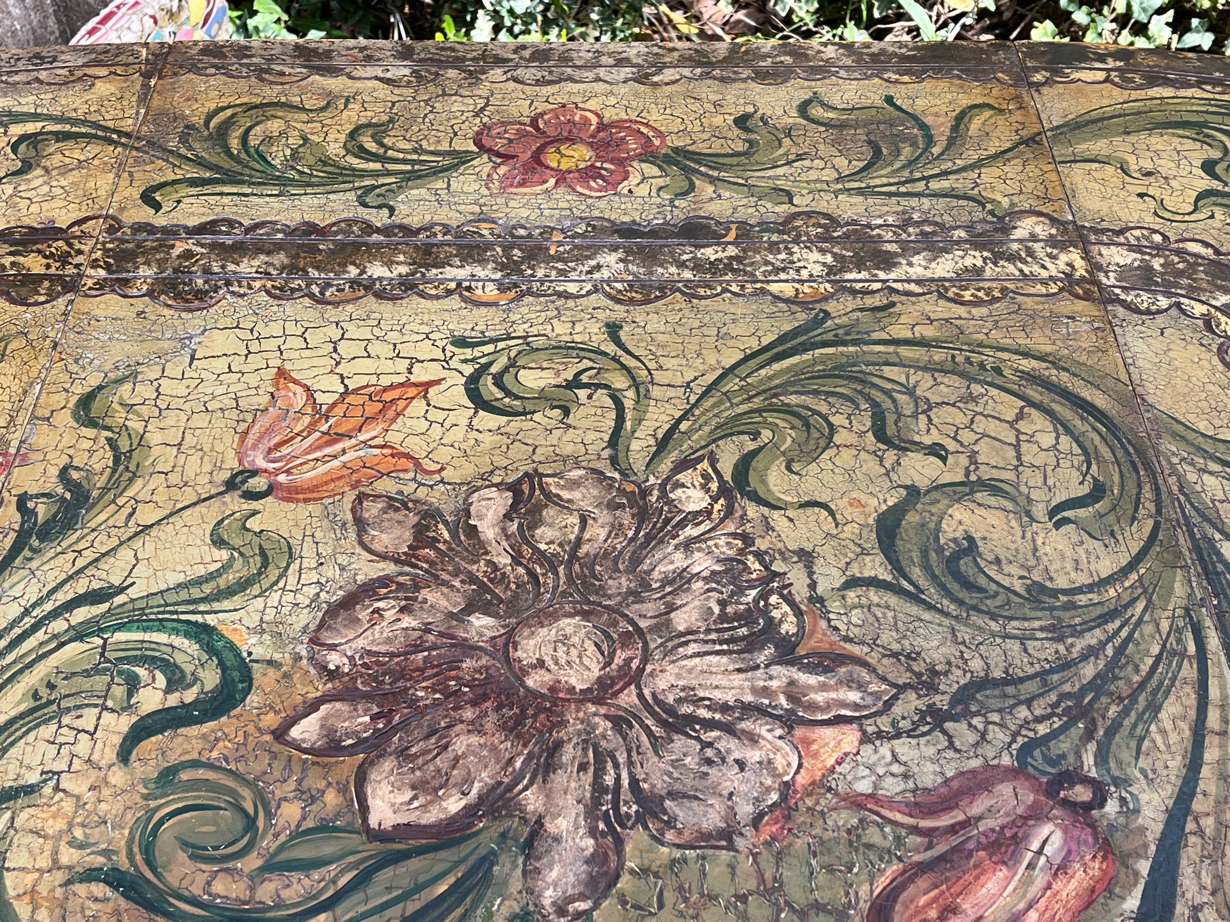Antique table, painted, drop-leaf, Italian. hand-painted top decorated in scrolling foliate and floral motifs in warm ochre, green, lavender and terracotta tones.