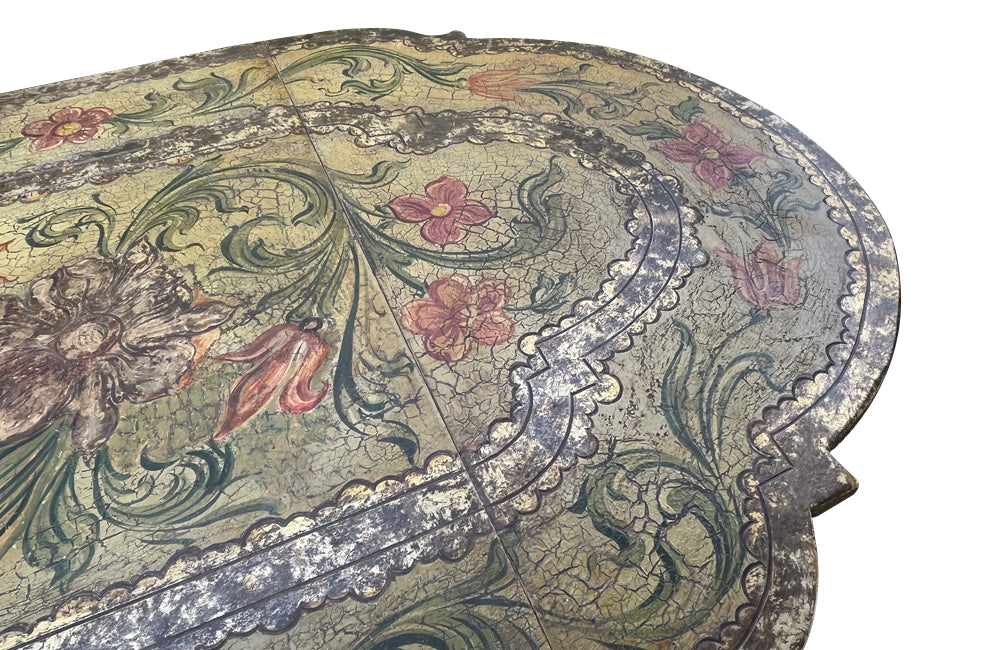 Antique table, painted, drop-leaf, Italian. hand-painted top decorated in scrolling foliate and floral motifs in warm ochre, green, lavender and terracotta tones.