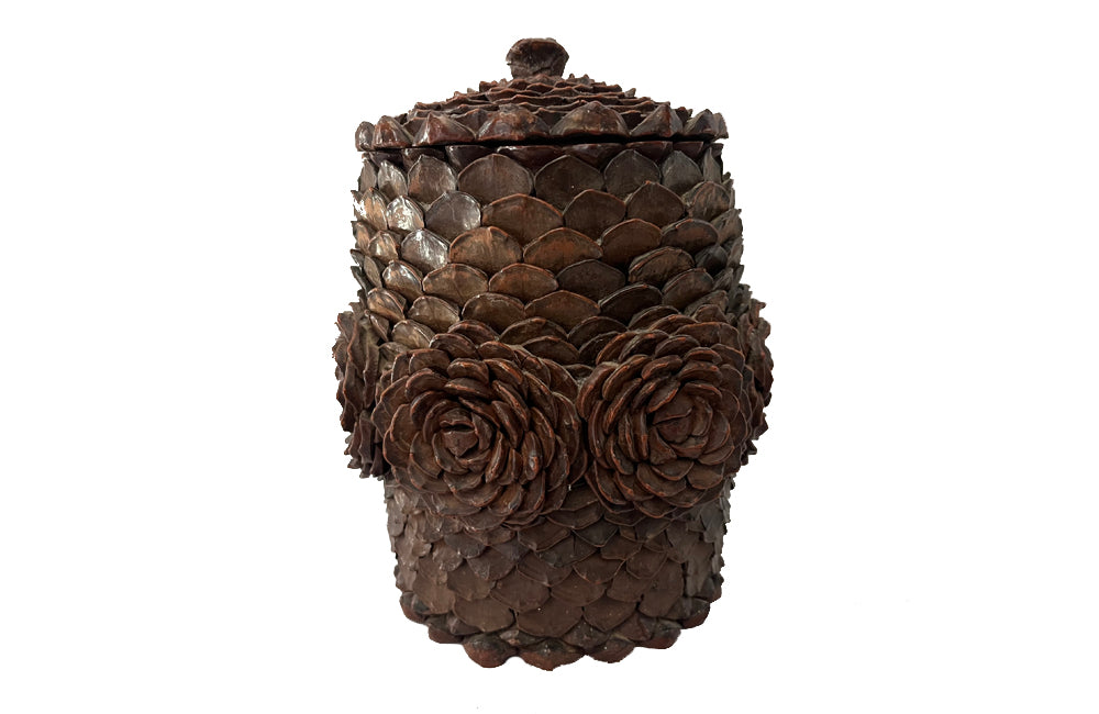 Antique Art Populaire wooden lidded jar covered in pine come flowers. French antiques.