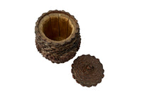 Antique Art Populaire wooden lidded jar covered in pine come flowers. French antiques.