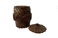 Antique Art Populaire wooden lidded jar covered in pine come flowers. French antiques.