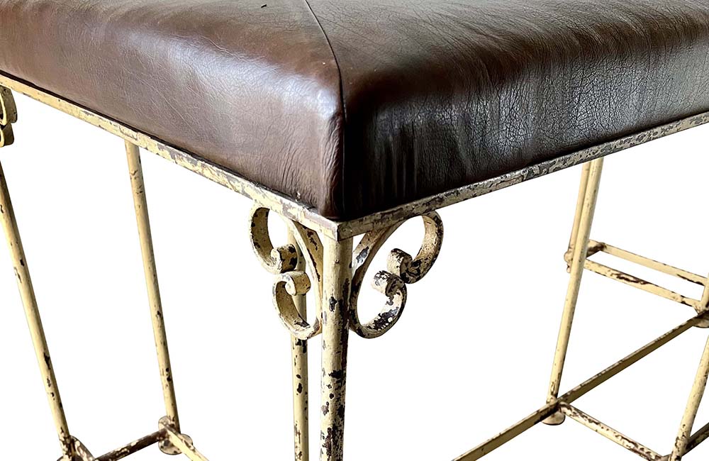 Large, late 19th century English fire fender with decorative wrought ironwork. Seat upholstered in leather. AD & PS Antiques