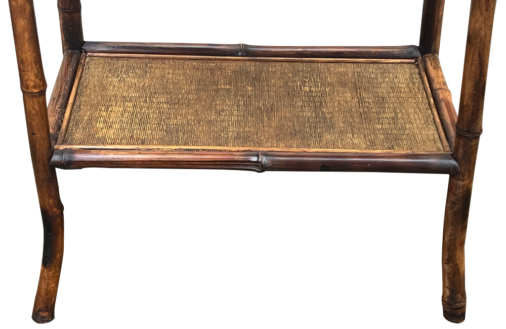 Early 20th Century French bamboo side table with two rattan shelves