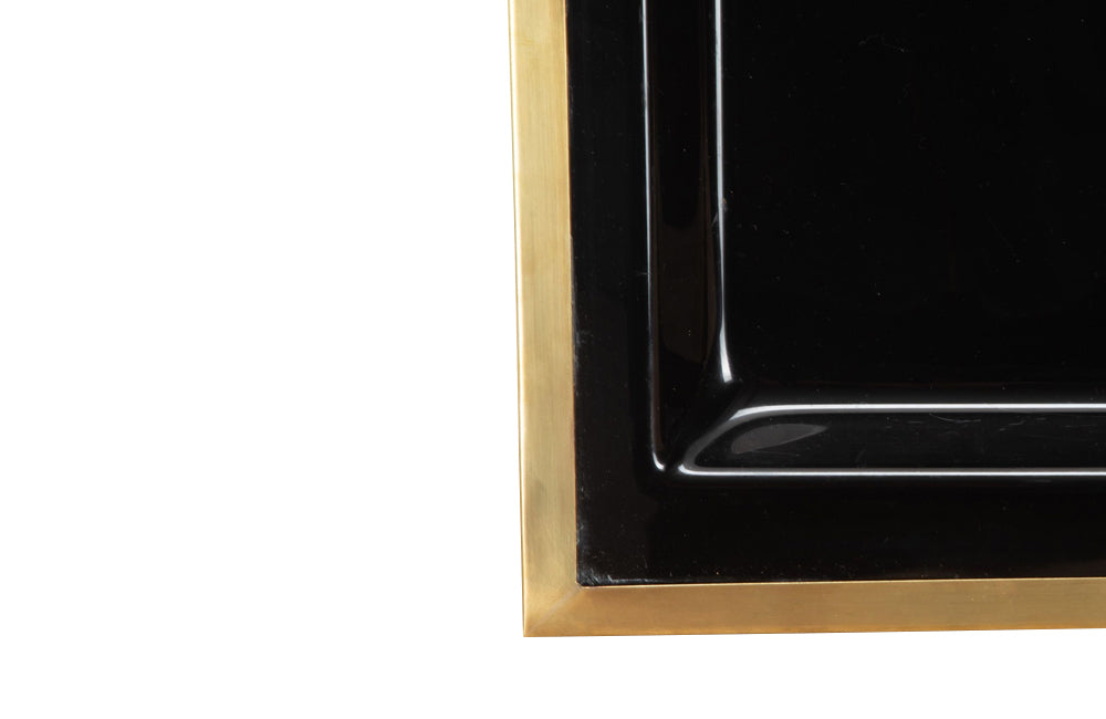 Elegant, mid century rectangular black lucite tray with brass rim.