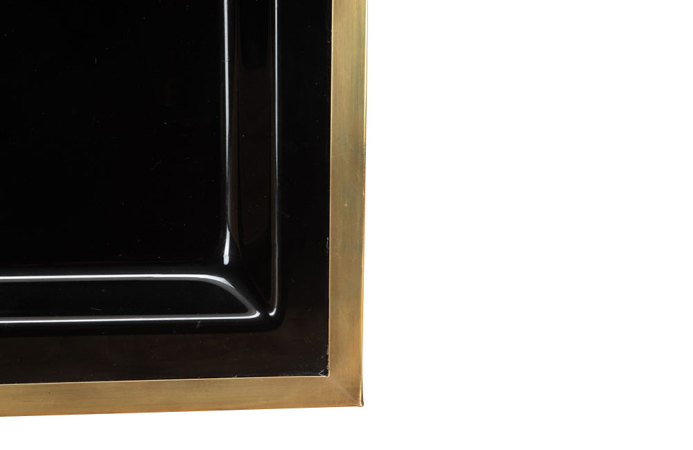 Elegant, mid century rectangular black lucite tray with brass rim.