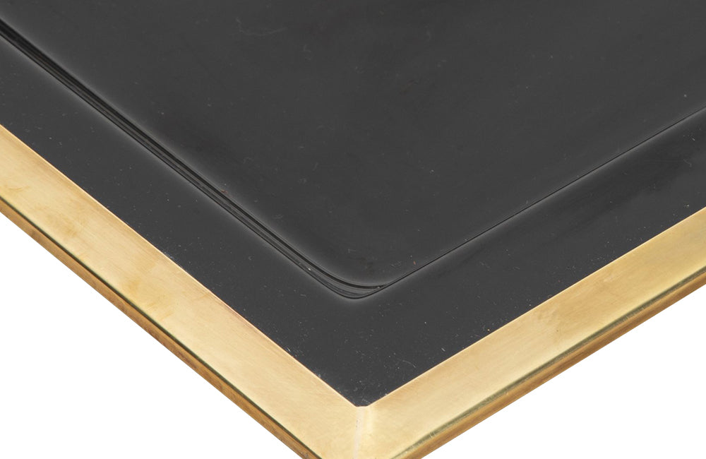 Elegant, mid century rectangular black lucite tray with brass rim.