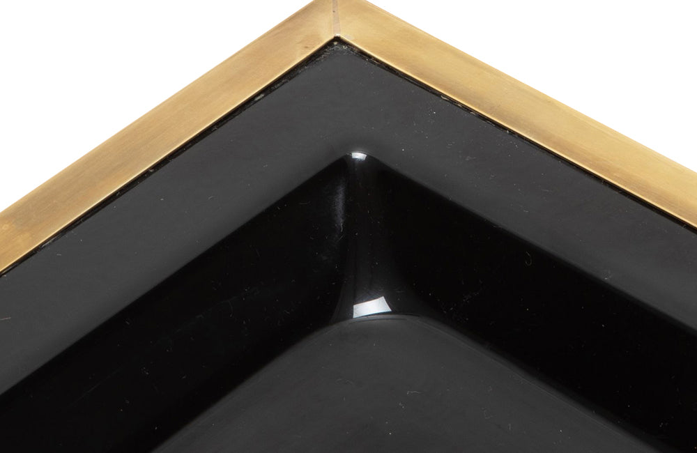 Elegant, mid century rectangular black lucite tray with brass rim.