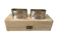 Very stylish Art Deco pair of silver plate napkin rings with cut out Madame and Monsieur lettering and stylised sun motifs.