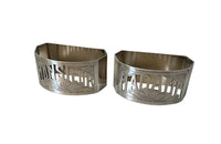 Very stylish Art Deco pair of silver plate napkin rings with cut out Madame and Monsieur lettering and stylised sun motifs.