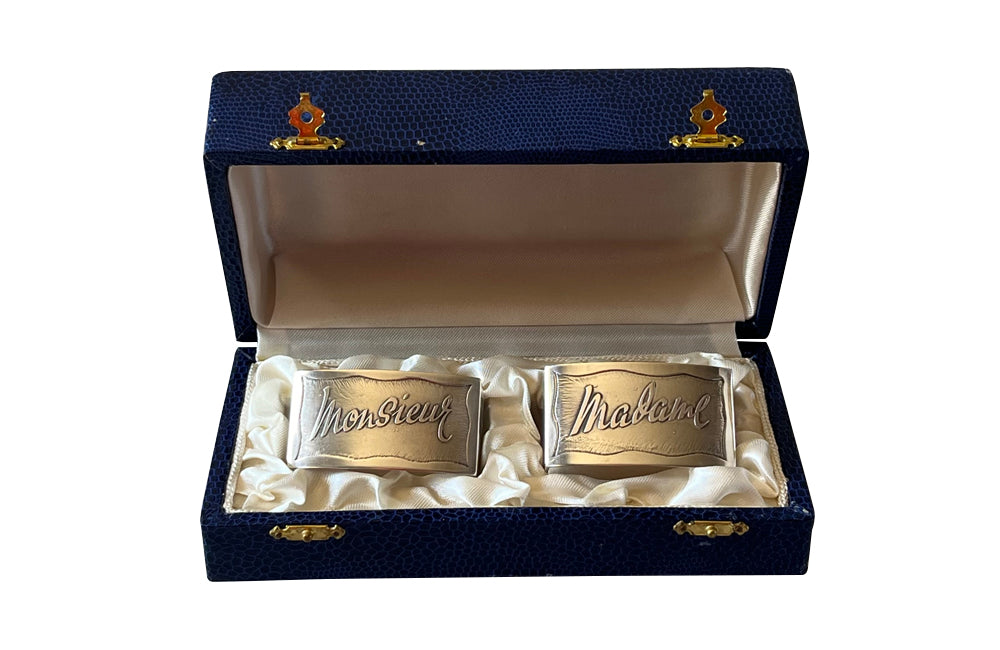 Pretty pair of vintage silver plate napkin rings with Madame and Monsieur cursive script in their original presentation box.