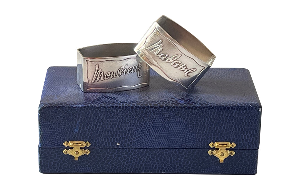 Pretty pair of vintage silver plate napkin rings with Madame and Monsieur cursive script in their original presentation box.