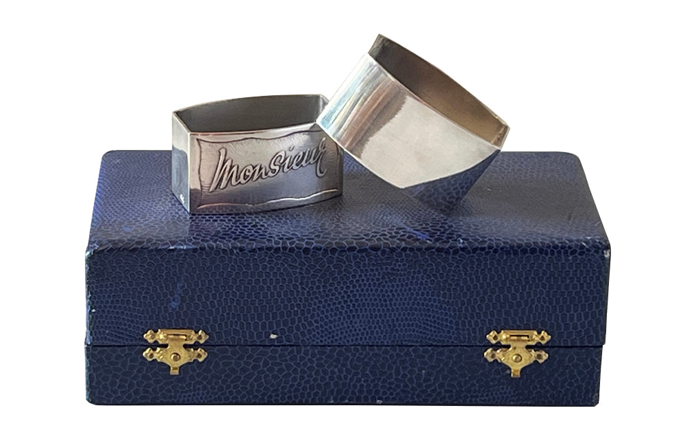 Pretty pair of vintage silver plate napkin rings with Madame and Monsieur cursive script in their original presentation box.