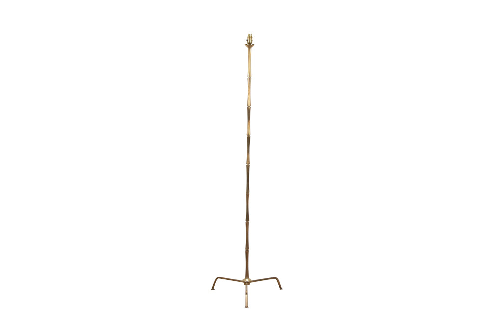 20th Century French stylish brass standard lamp with segmented stem and upright terminating on an elegant simple tripod base.