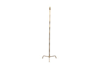 20th Century French stylish brass standard lamp with segmented stem and upright terminating on an elegant simple tripod base.