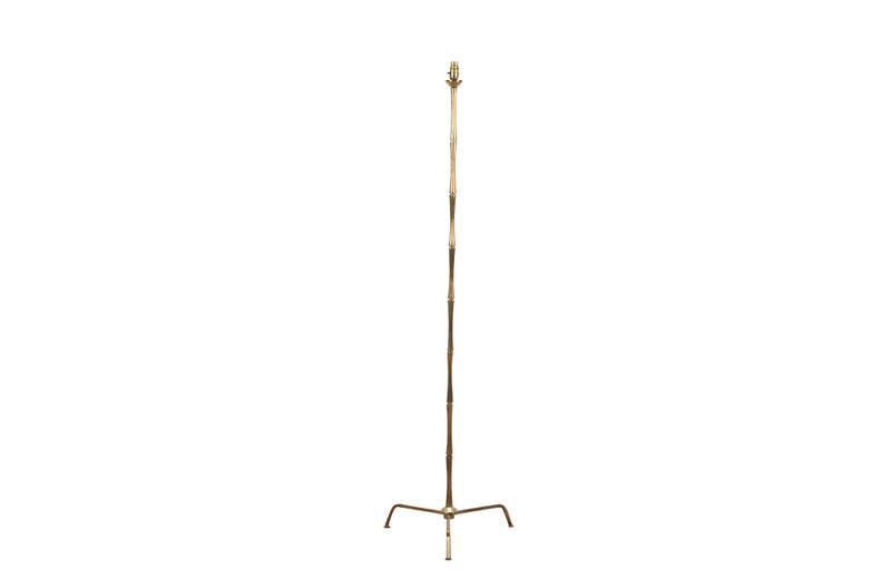 20th Century French stylish brass standard lamp with segmented stem and upright terminating on an elegant simple tripod base.