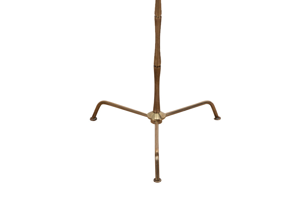 20th Century French stylish brass standard lamp with segmented stem and upright terminating on an elegant simple tripod base.