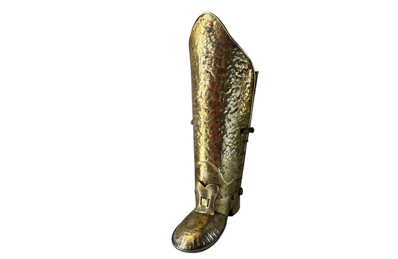 Decorative umbrella stand in the form of a large brass riding boot with brass laces to both sides, heel and spur.