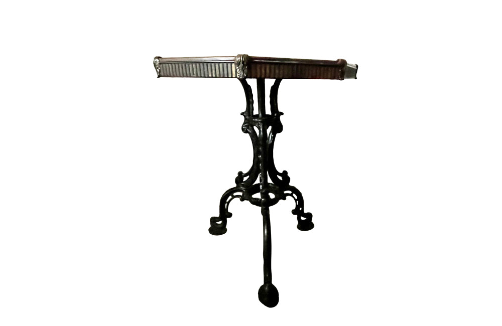FRENCH IRON GUERIDON WITH EMBOSSED BRASS TOP