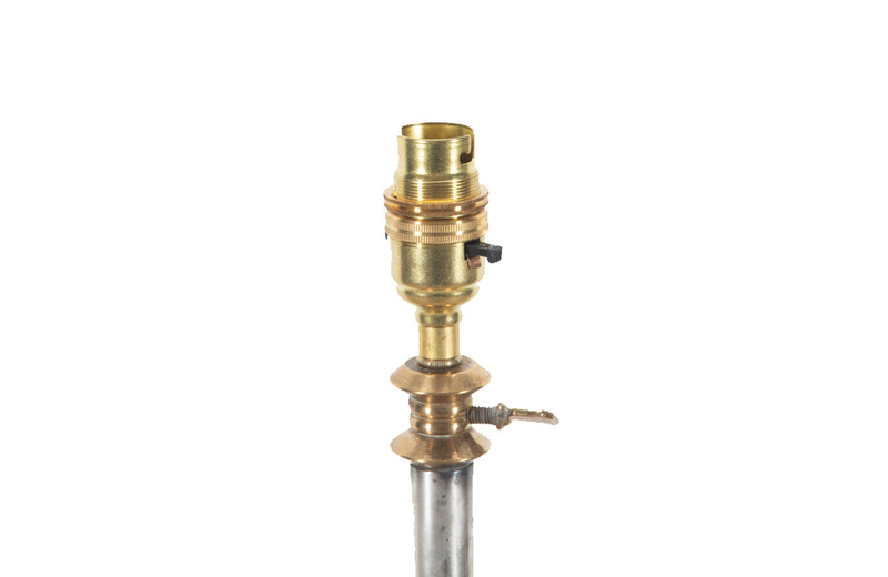 Mid 20th century polished steel and brass ringed stem terminating on tripod brass base.