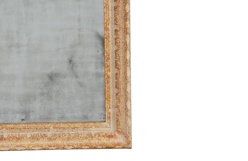 Small early 20th century French mirror with old mirror glass and carved frame with original paint and lovely patination.