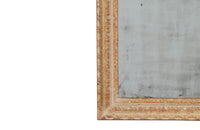 Small early 20th century French mirror with old mirror glass and carved frame with original paint and lovely patination.