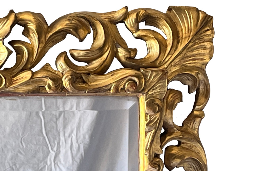 Beautiful 19th century openwork carved giltwood framed mirror in the Louis XIV style.