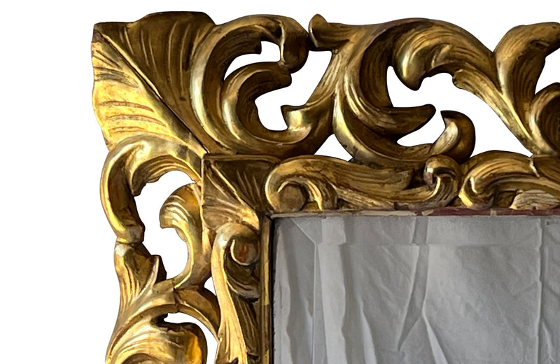 Beautiful 19th century openwork carved giltwood framed mirror in the Louis XIV style.
