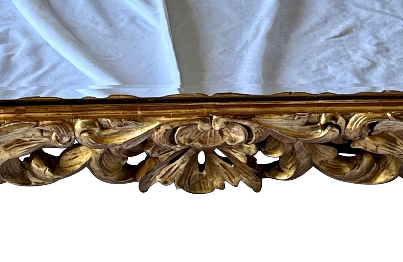 Beautiful 19th century openwork carved giltwood framed mirror in the Louis XIV style.