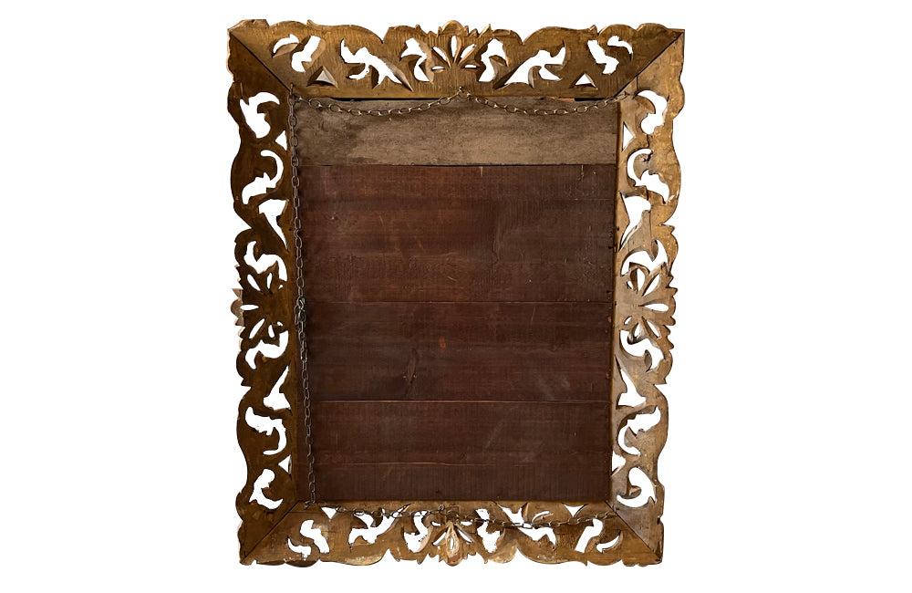 Beautiful 19th century openwork carved giltwood framed mirror in the Louis XIV style.