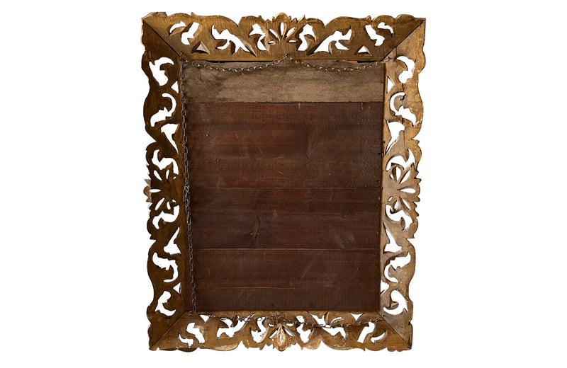 Beautiful 19th century openwork carved giltwood framed mirror in the Louis XIV style.